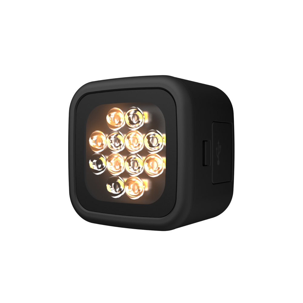 Compact LED smart video light with adjustable brightness and color temperature, portable and lightweight design.