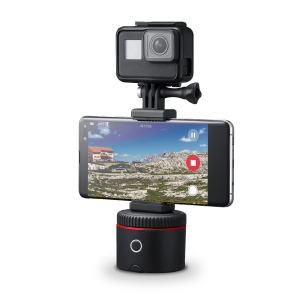 Pivo Action Mount with camera and smartphone attached, featuring universal design and lightweight construction.
